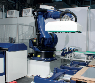 The Kuka-Robot picks up the sheet via suction.